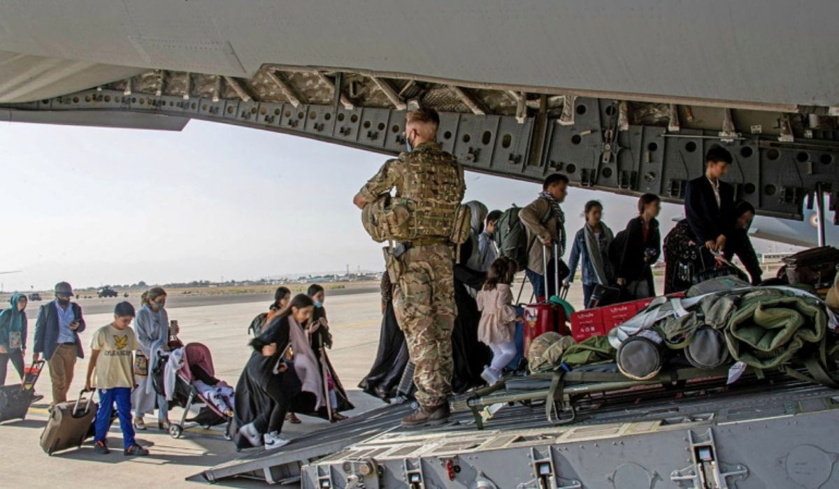 Evacuations from Afghanistan gather momentum as Taliban promise peace
